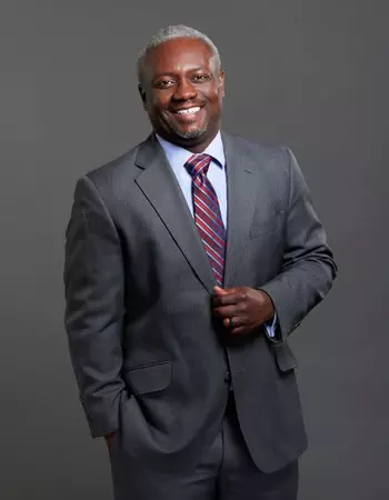 Photo of Dr. Dedrick Sims in a suit